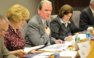 Image of court unit executives and AO staff discussing at work session