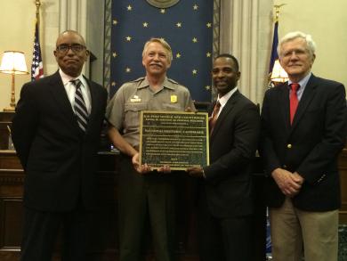 National Park Service presents plaque to Frank M. Johnson Jr. Federal Building and U.S. Courthouse in Montgomery, Alabama on July 20, 2015.