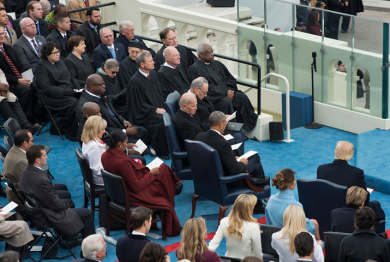 U.S. Supreme Court justices seated on the presidential platform.