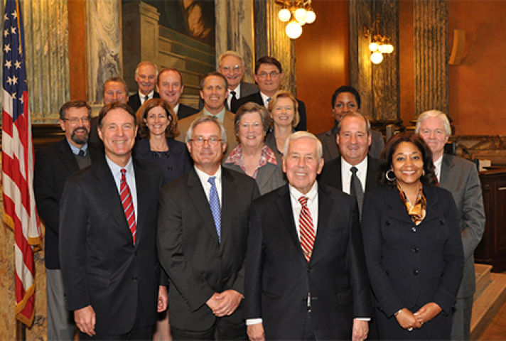 Former Senator Evan Bayh (front row left) and Senator Richard Lugar (front row, second from right) met with the judges in Indianapolis.
