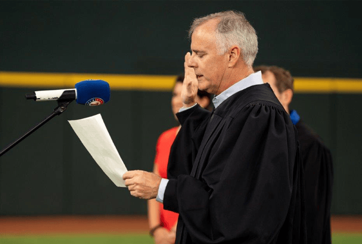 U.S. District Judge Reed O'Connor at a naturalization ceremony at Globe Life Field in Arlington, Texas.