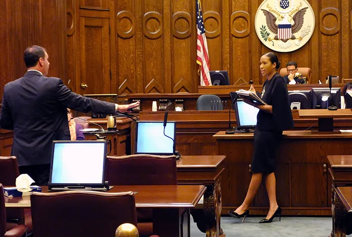 Chanise Anderson, a lawyer attending the Litigation Academy, receives guidance on how to enter a document into evidence.