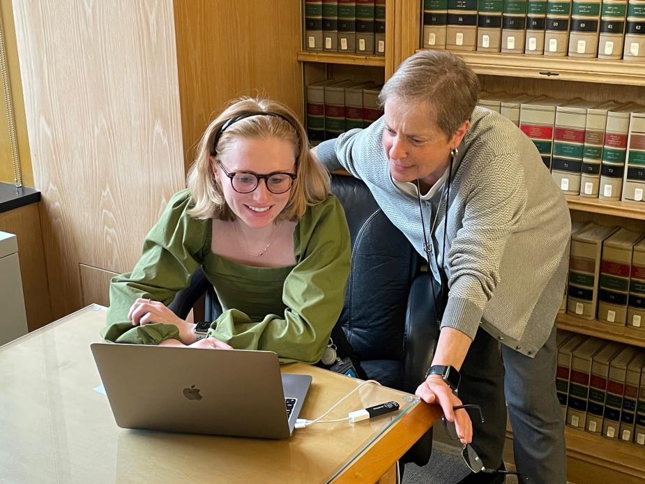 Patricia Michalowskij, circuit librarian for the U.S. Court of Appeals for the D.C. Circuit, right, trains a court employee in using a legal research database.