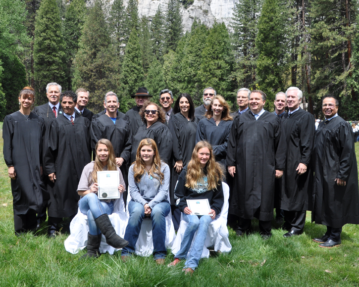 At a Yosemite Valley ceremony, student essay contest winners are flanked by 16 federal and state judges. 