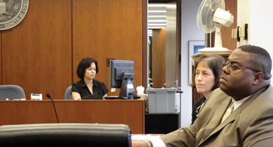 Image of staff court reporters in a courtroom