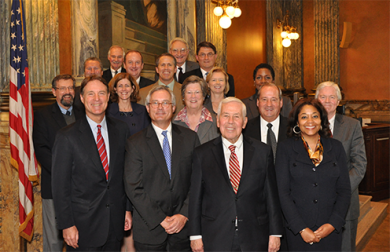 Former Senator Evan Bayh (front row left) and Senator Richard Lugar (front row, second from right) met with the judges in Indianapolis.