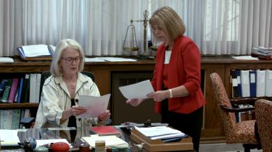 U.S. District Judge Janet Arterton, left, and Clerk of Court Robin Tabora look at documents. 