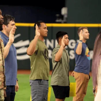 New U.S. citizens at a naturalization ceremony at Globe Life Field in Arlington, Texas.