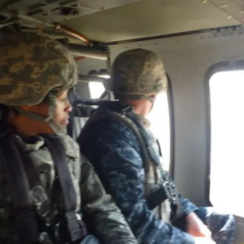 Image: Marcia Anderson looking out of a helicopter window. 