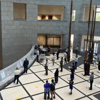 Citizens stand a socially distanced six feet apart in the lobby of the federal courthouse in Kansas City, Missouri. 