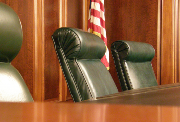Fourth Circuit Court of Appeals courtroom showing three chairs. 