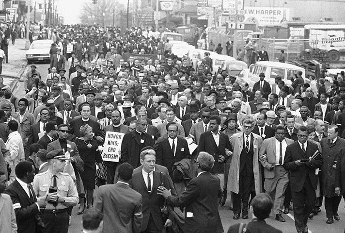 On April 8, grieving followers gather for the march Martin Luther King, Jr., had planned to lead. 