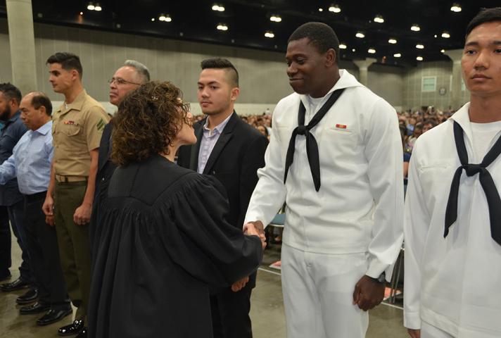 The federal court shakes hands with new citizens who serve in the military.