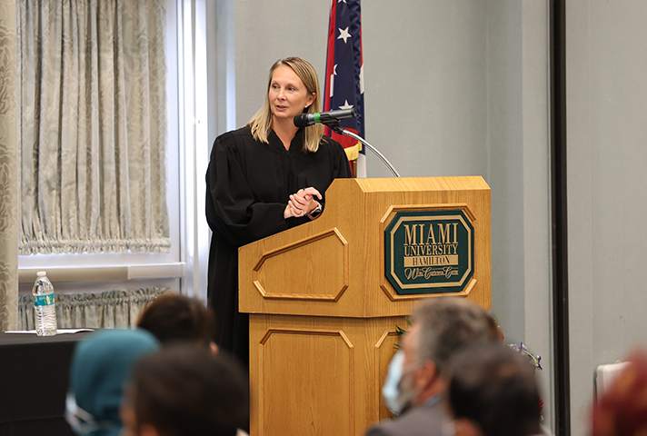 U.S. Magistrate Judge Stephanie K. Bowman welcomes new citizens at a naturalization ceremony at Miami University in Hamilton.