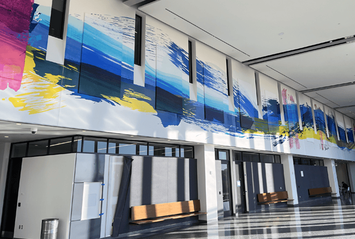 An abstract mural of the Susquehanna River stretches across the entryway walls of the new federal courthouse in Harrisburg, Pennsylvania.