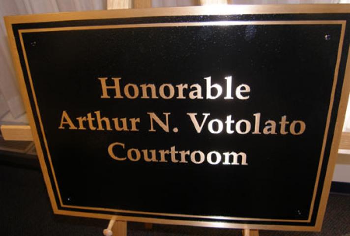 The courtroom Votolato has presided in since 1982 was dedicated in his honor with a plaque unveiled during the ceremony.