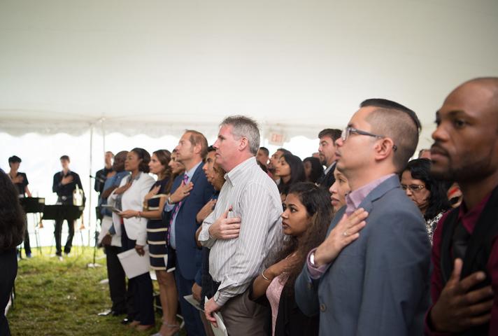 New citizens say the Pledge of Allegiance. 
