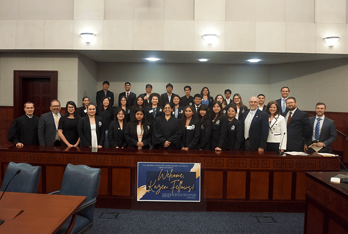 Judges and program facilitators celebrate the first class of Kazen fellows during a graduation ceremony at the federal courthouse in Laredo, Texas.