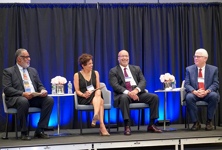 Image of panelists from symposium.