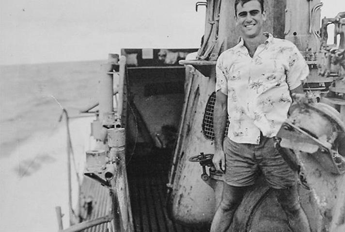 Navy Lt. Jack B. Weinstein stands on the deck of the submarine USS Jalloa, in the Pacific theater.
