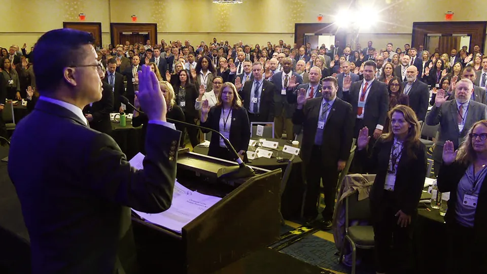 Probation and Pretrial Services officers reaffirm their oath of office.
