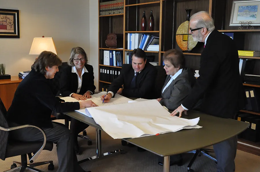 Third Circuit Court staff examine an innovative redesign plan that will enable out-of-town-judges hearing cases in Philadelphia to share chambers space more efficiently. From left are Rebecca Yoder, Interior Designer; Margaret Wiegand, Circuit Executive; Third Circuit Court staff examine an innovative redesign plan that will enable out-of-town-judges hearing cases in Philadelphia to share chambers space more efficiently. From left are Rebecca Yoder, Interior Designer; Margaret Wiegand, Circuit Executive;