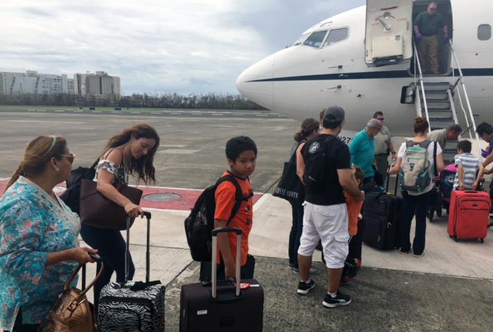 Families of federal probation officers leave Puerto Rico after Hurricane Maria.