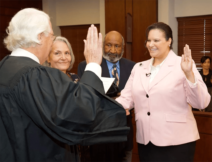 Ada Brown is sworn in as a federal judge as her parents look on at the federal courthouse in Dallas.