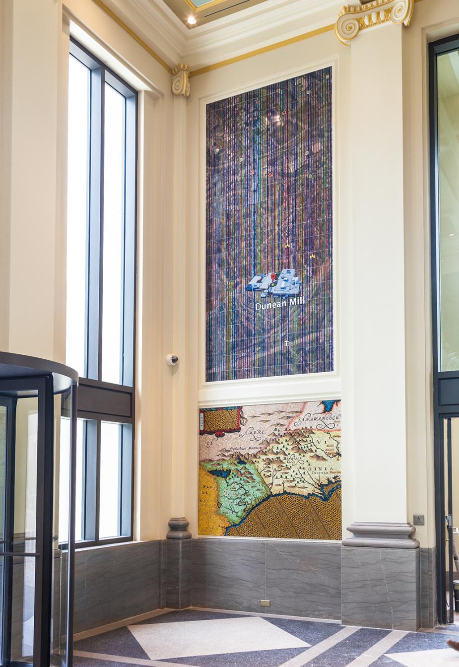 A suite of ceramic tile and glass mosaics that feature present-day Google Earth aerial views of textile mills in communities served by the courthouse.