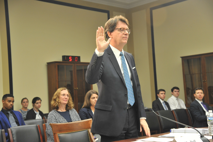 James C. Duff, director of the Administrative Office of the U.S. Courts, is sworn in.