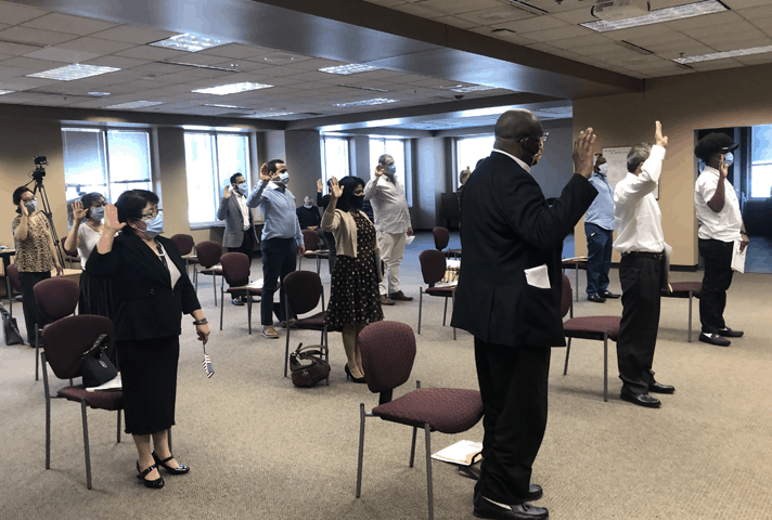 Citizens take the Oath of Allegiance to the United States during a ceremony at the federal courthouse in Kansas City, Kansas.