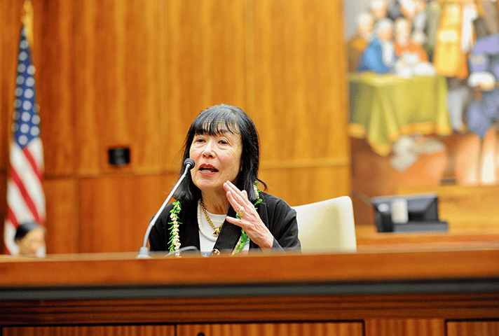 Karen Korematsu, executive director of the Fred T. Korematsu Institute, speaks as a panelist during a special program at a federal courthouse.