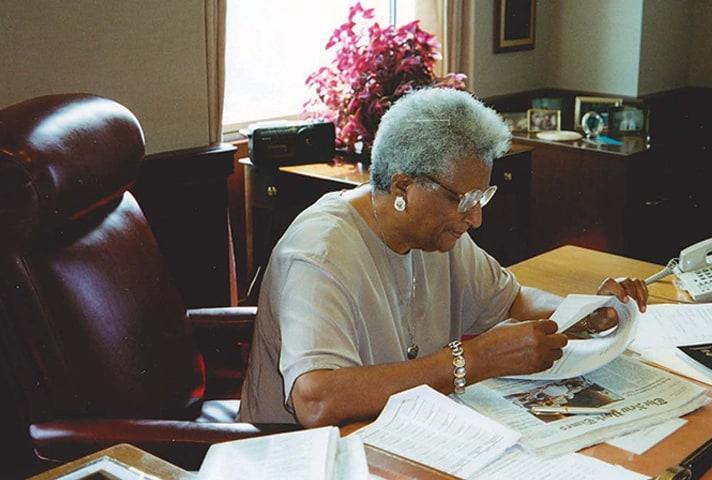 In her later years, Judge Constance Baker Motley works at her desk.