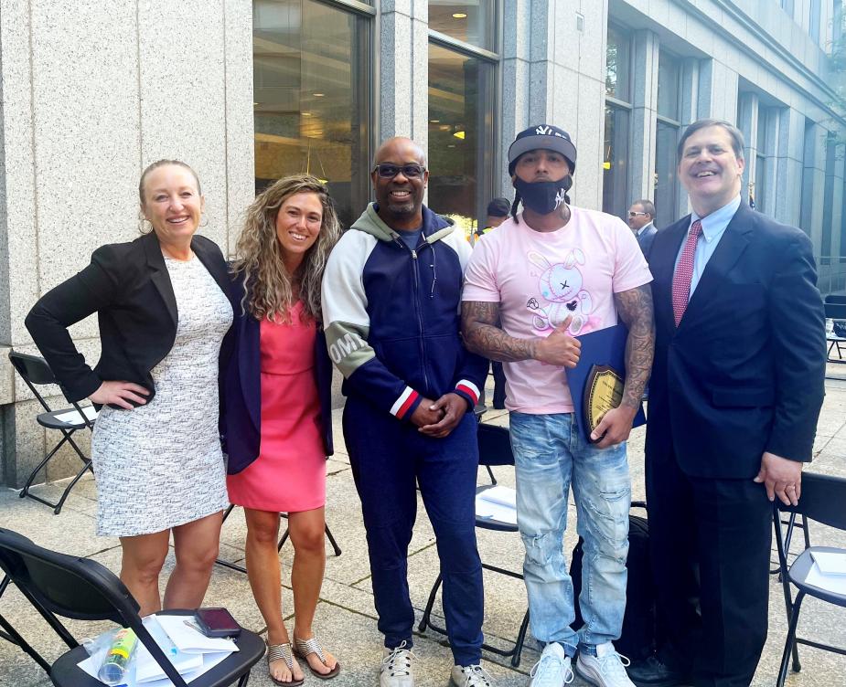From left to right, Probation Officers Elisha Rivera and Lauren Blackford, RISE Court graduates Michael Lewis and Vincent Hernandez, and Magistrate Judge James L. Cott, of the Southern District of New York.