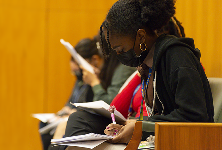 Students take notes during the 2022 Justice Institute in New York.