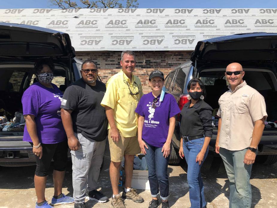 Probation staff from three districts participated in a clothing and supplies giveaway in Lake Charles. From left: Myra Kirkwood, Chief U.S. Probation Officer, Eastern District of Texas; Clint Mitchell, Deputy Chief U.S. Probation Officer, Western District
