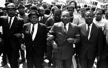 Martin Luther King, Jr., leads a sanitation workers' protest that dissolved into vandalism.