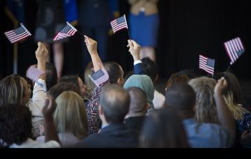 Flags waving during naturalization ceremony.